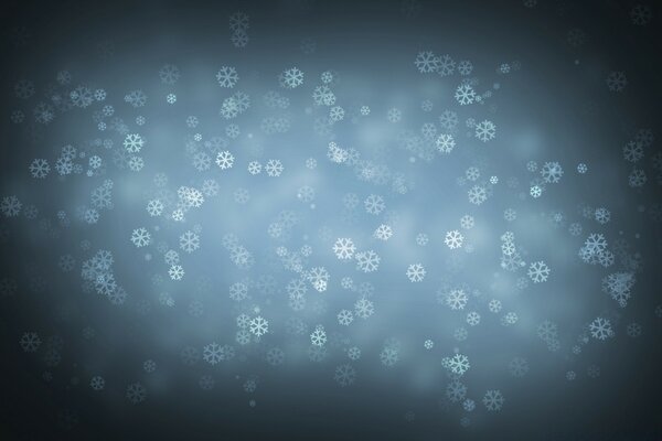 Fallende Schneeflocken am dunklen Himmel